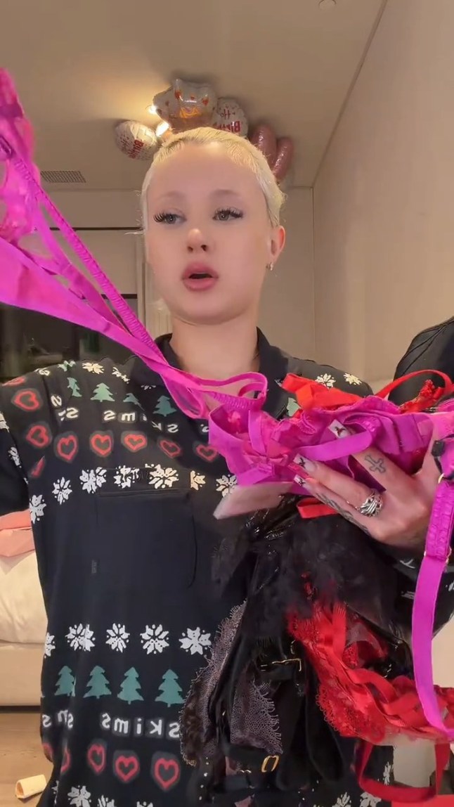 Alabama Barker shows off her haul of Christmas presents from her family and her