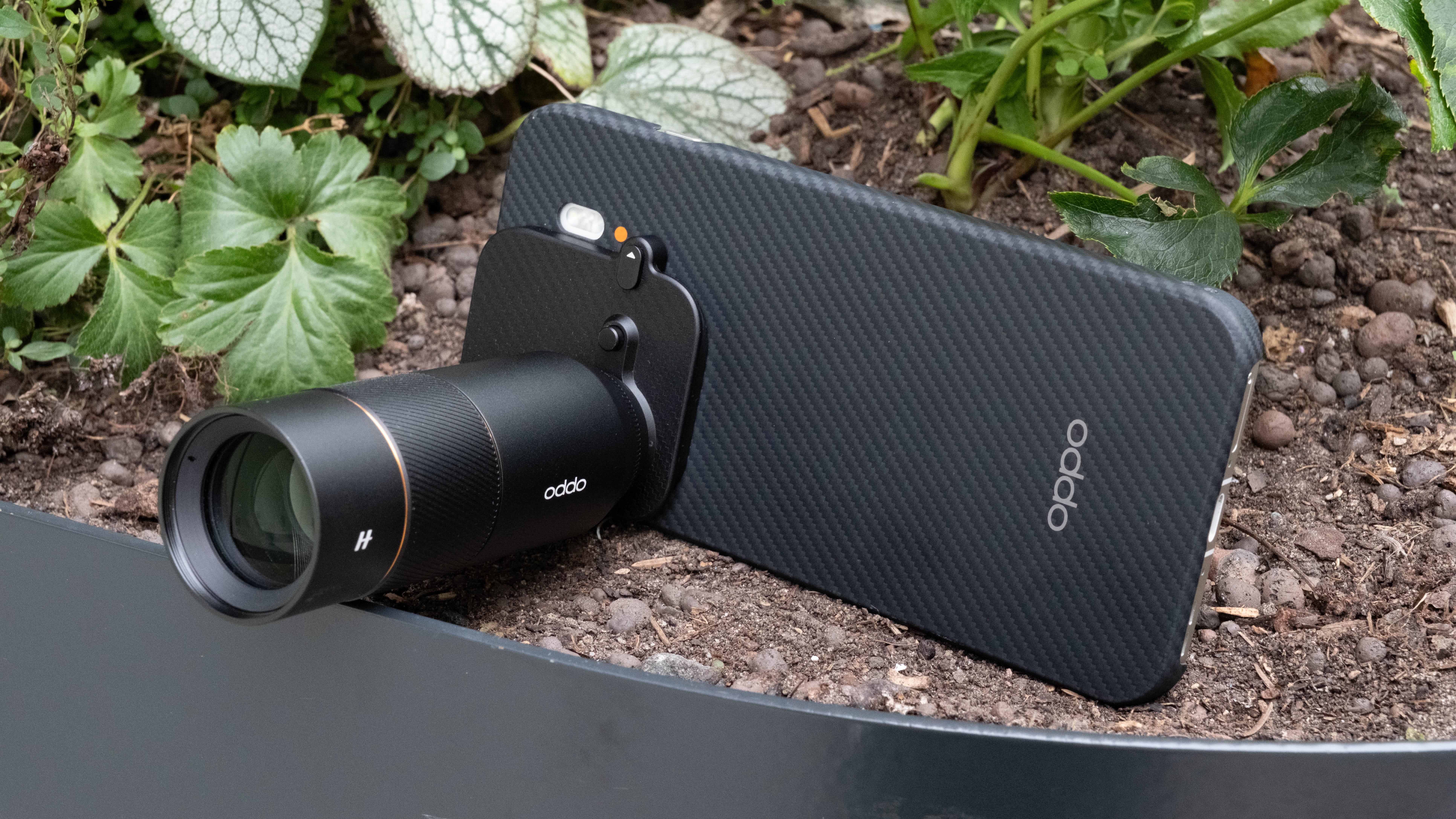 Oppo Find X9 Pro phone with Hasselblad teleconverter attached