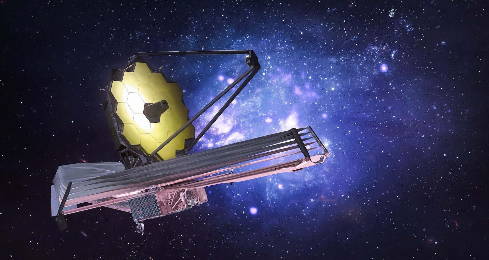 Image of the James Webb Space Telescope placed in front of a star-filled blue and black background.