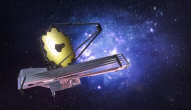 Image of the James Webb Space Telescope placed in front of a star-filled blue and black background.