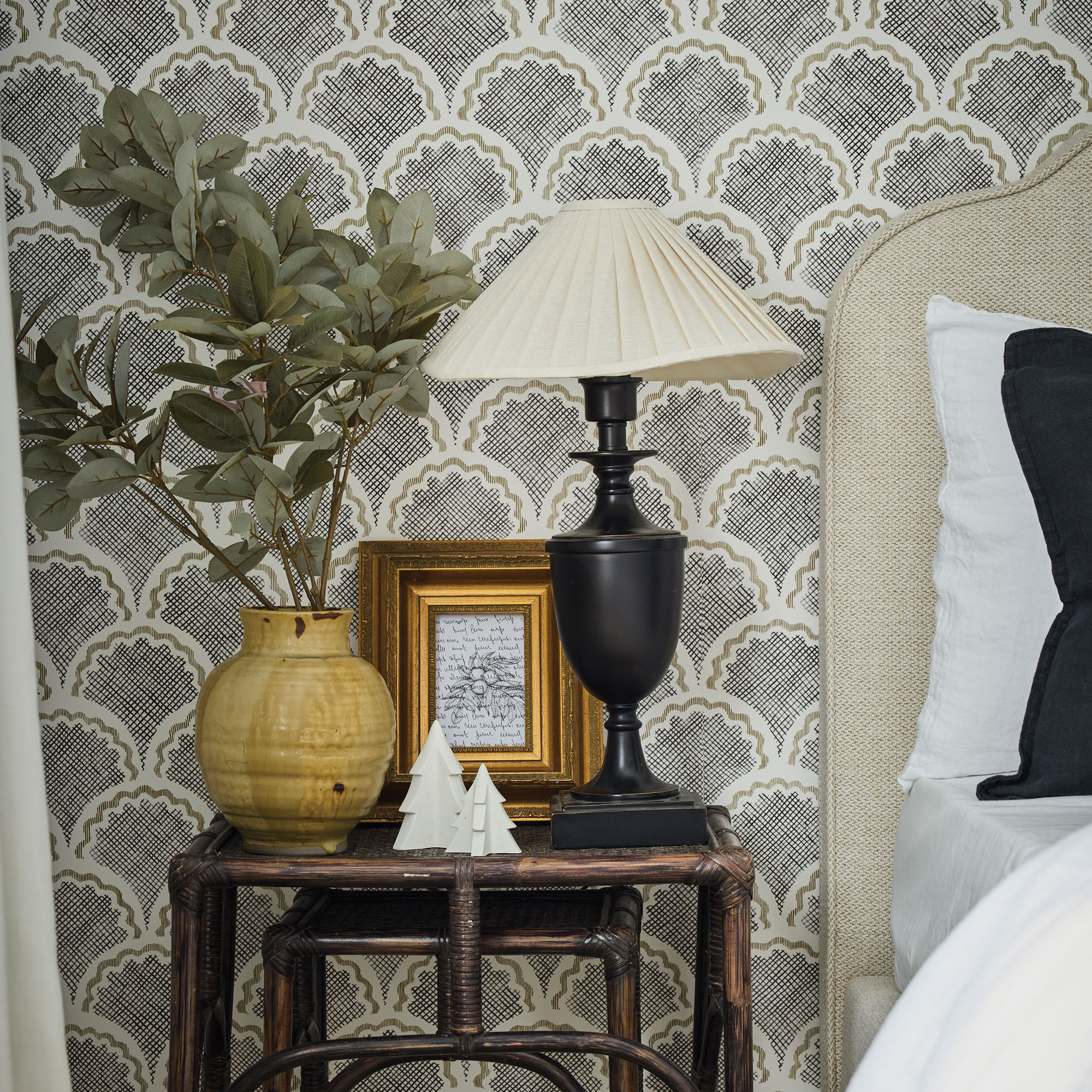 Bedside table with a lamp, vase, frame and christmas decorations