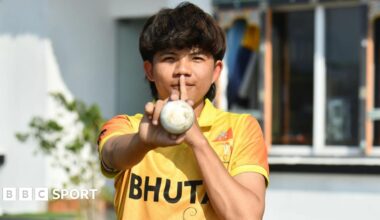 Sonam Yeshey puts his finger to lips to celebrate taking eight wickets for Bhutan