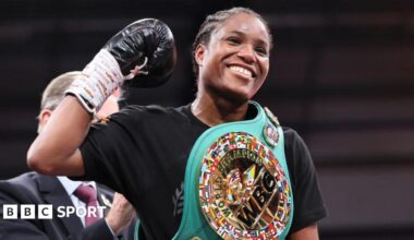 Caroline Dubois smiles with her WBC title around her shoulder