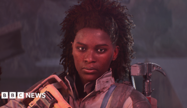 Screenshot from Arc Raiders shows a character holding a large rifle and with a hammer-like tool strapped to her back giving a determined look towards the camera.