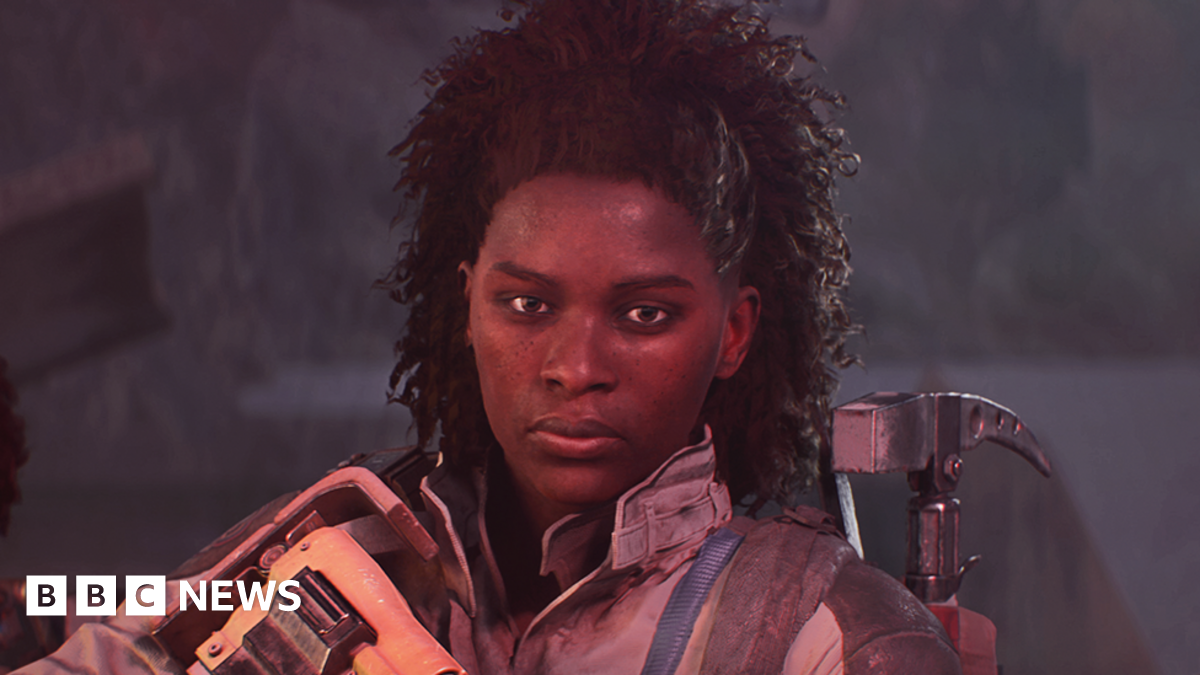 Screenshot from Arc Raiders shows a character holding a large rifle and with a hammer-like tool strapped to her back giving a determined look towards the camera.