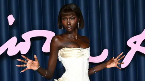 Getty Images  Anok Yai in a white corseted dress