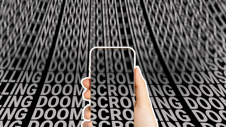 Mobile phone in hand against the background of an endless scroll of words.