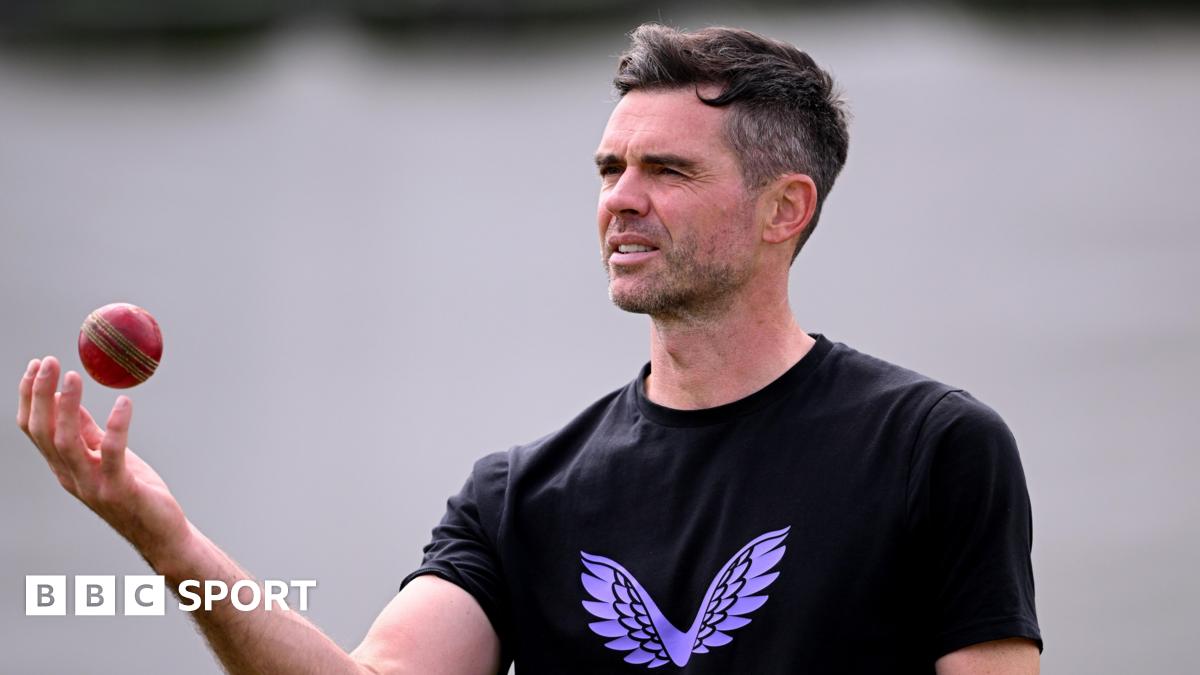 Former England bowler James Anderson tosses a ball in the air