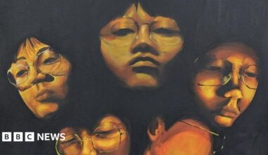 A piece of art work depicting four faces in shadow