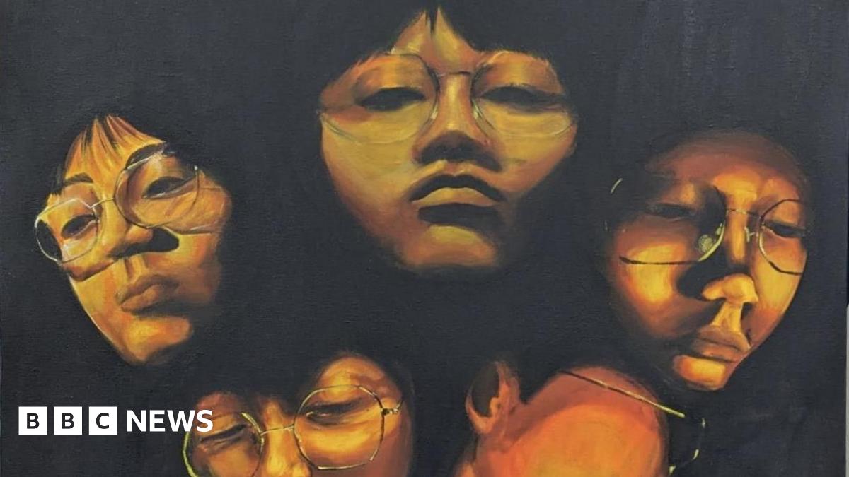 A piece of art work depicting four faces in shadow