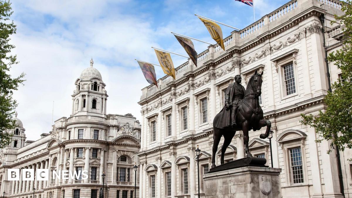 Whitehall street in London a cloudy day with cenotaph war memorial and Foreign and Commonwealth Office
