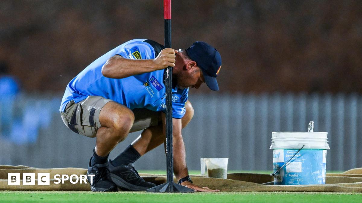 Groundstaff attend to pitch in Adelaide
