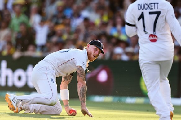 That was close: Ben Stokes takes the catch to dismiss Starc, despite a near collission with Ben Duckett.