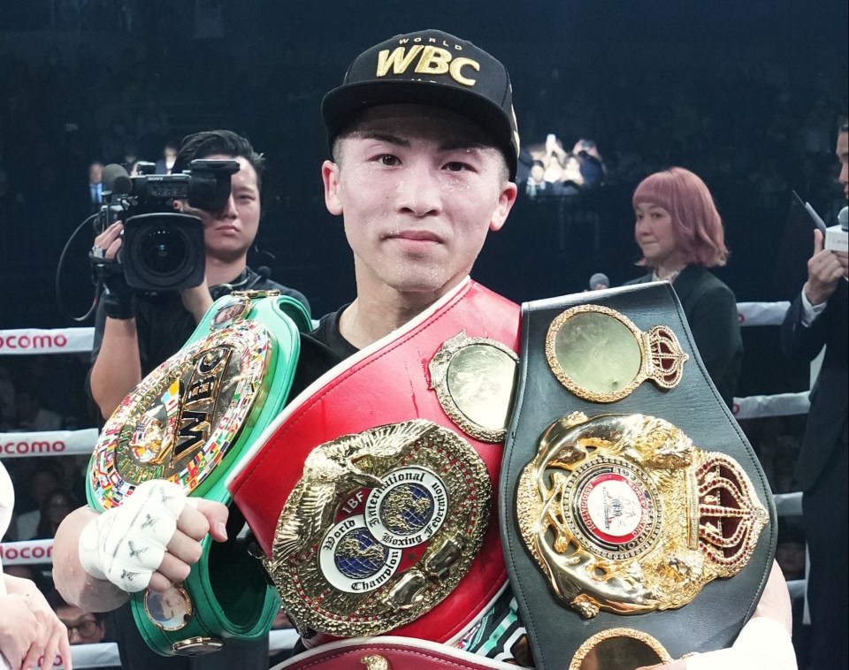 Naoya Inoue, undisputed super-bantamweight world champion, holding his championship belts