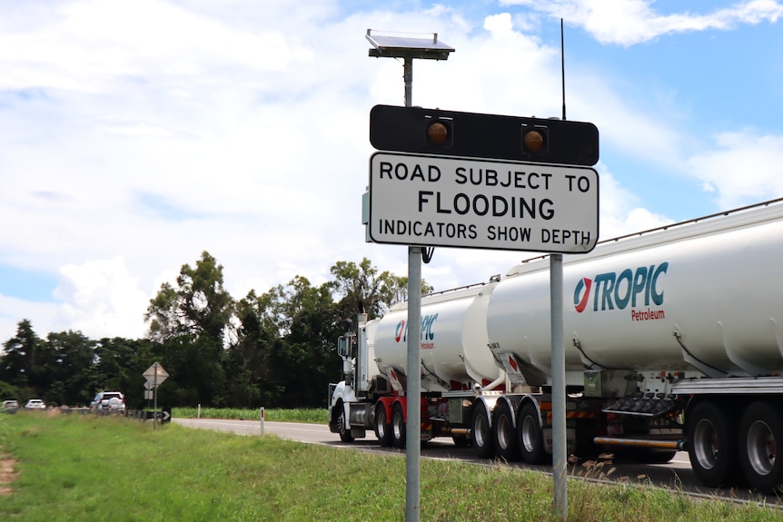Truck drives onto Bruce Highway crossing at Gairloch.