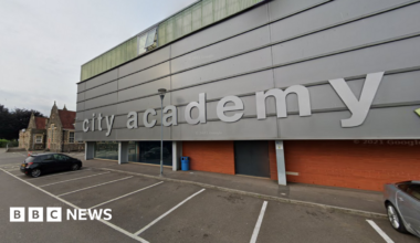 Google image of the outside of City Academy - a building with the silver, metal clad exterior with 'city academy' written in silver letters.