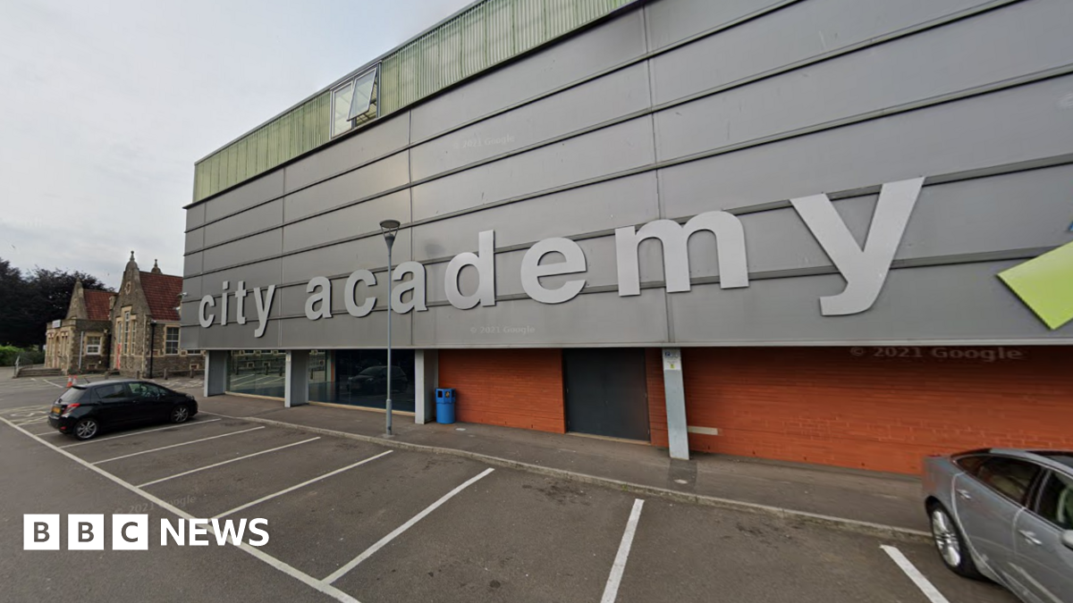 Google image of the outside of City Academy - a building with the silver, metal clad exterior with 'city academy' written in silver letters.