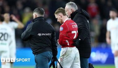 Lewis O'Brien is helped off