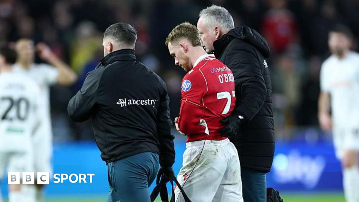 Lewis O'Brien is helped off