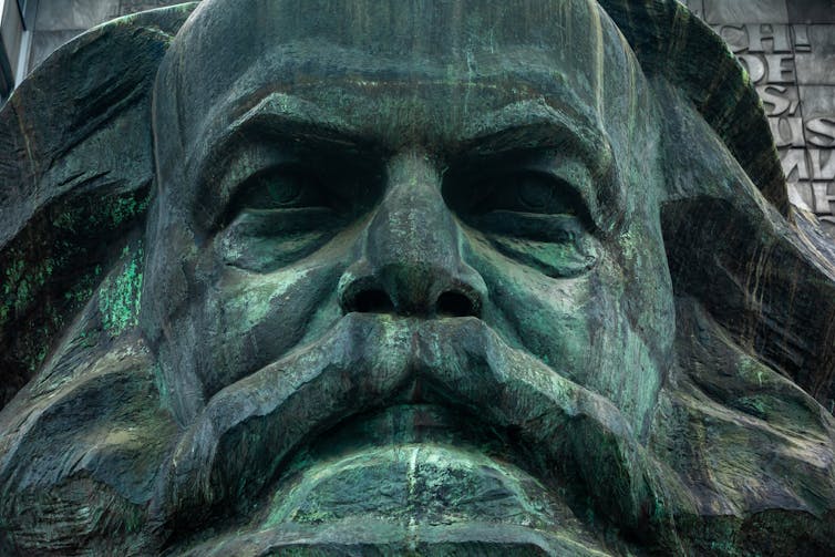 Partial view of Karl Mark bronze statue.