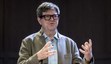 Yann LeCun gestures with both hands while speaking at the World Economic Forum annual meeting.