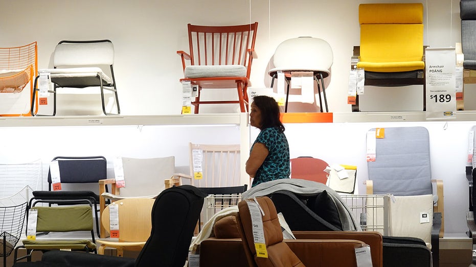 A customer shops for furniture at an IKEA store