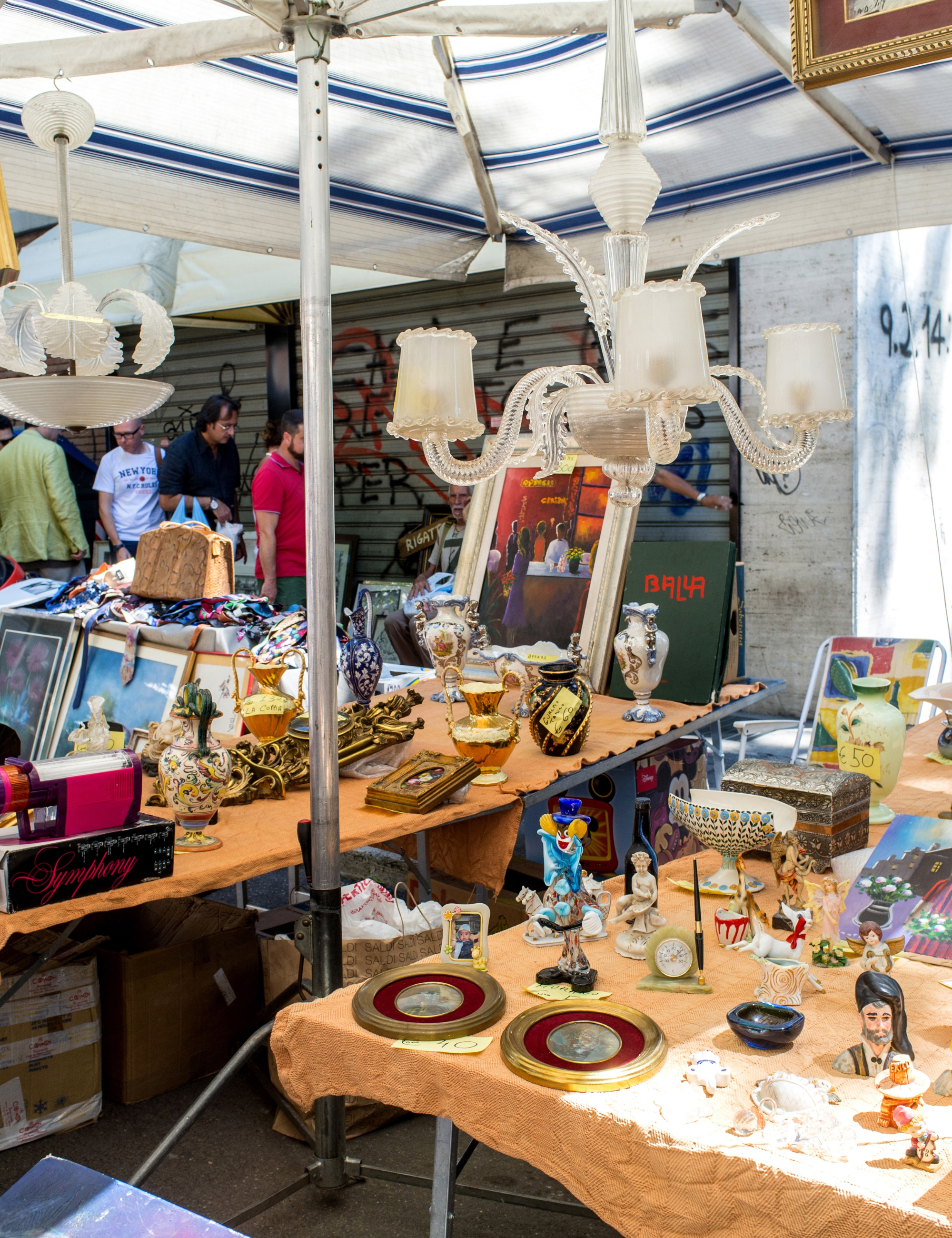 Outdoor antique sale featuring assorted collectibles