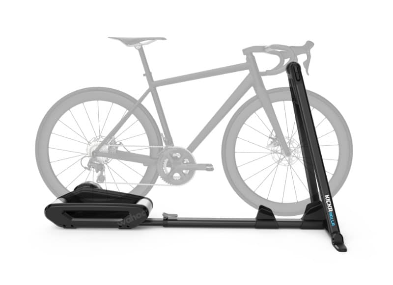 Picture showing an indoor smart bicycle trainer with a bicycle mounted for use.