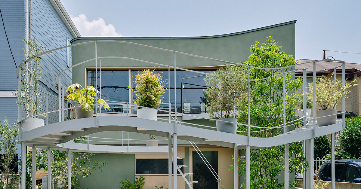 terrace arcs toward the street to bring light in tokyo home by HOAA