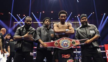 Abdullah Mason poses with the WBO lightweight belt alongside his team after beating Sam Noakes, a breakout win that sparked debate about his readiness for the elite lightweights.