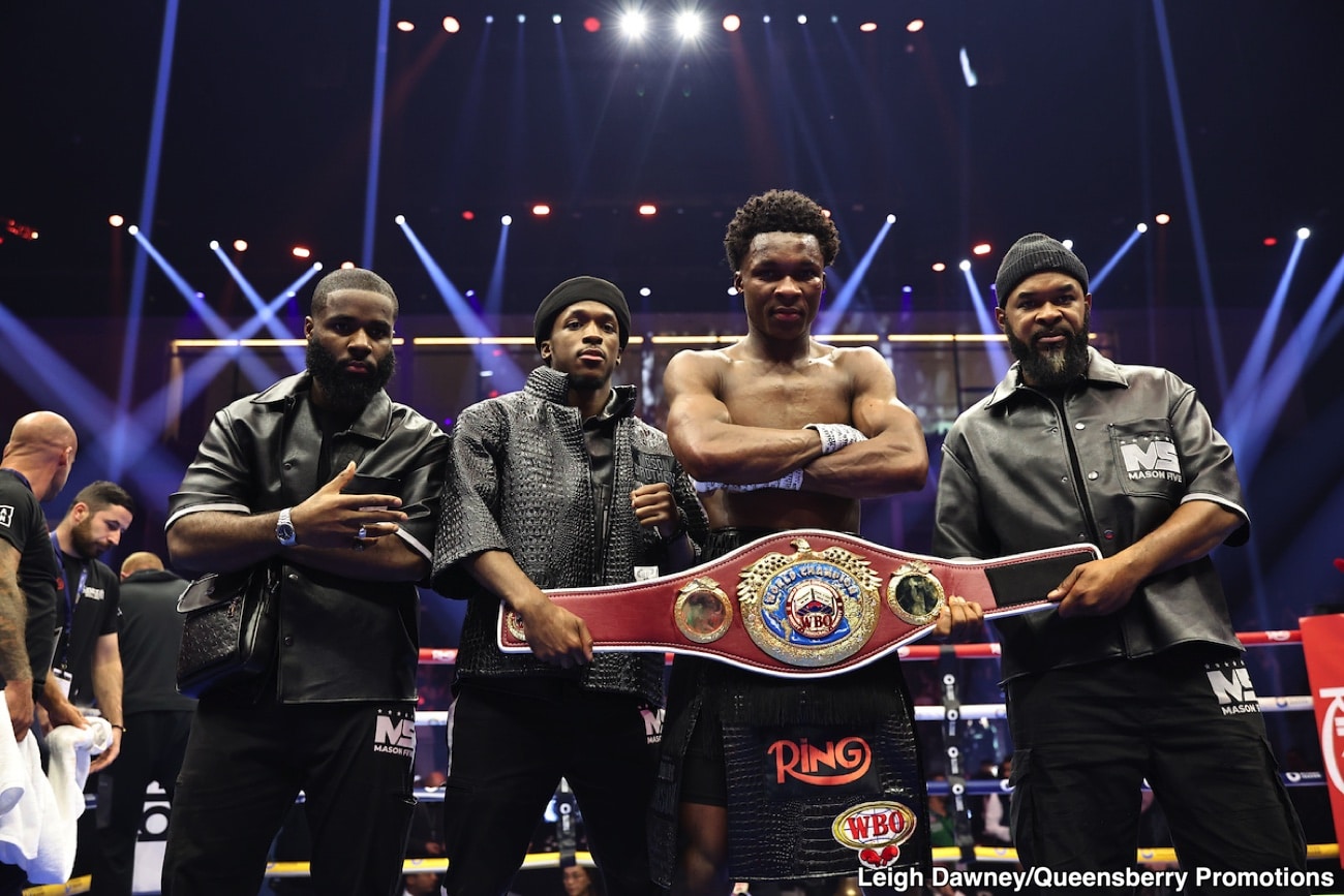 Abdullah Mason poses with the WBO lightweight belt alongside his team after beating Sam Noakes, a breakout win that sparked debate about his readiness for the elite lightweights.