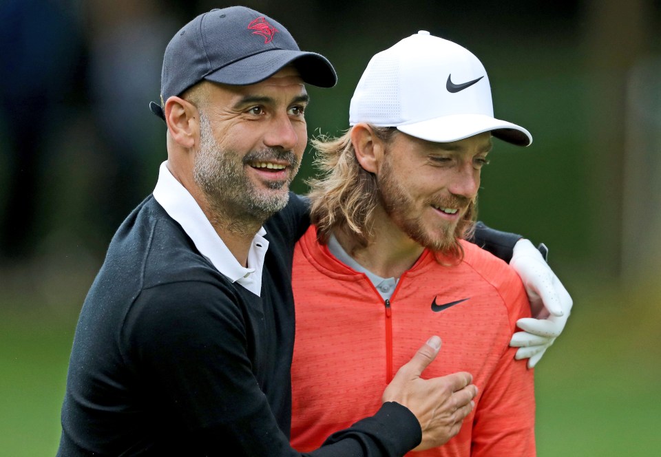 Pep Guardiola hugs Tommy Fleetwood