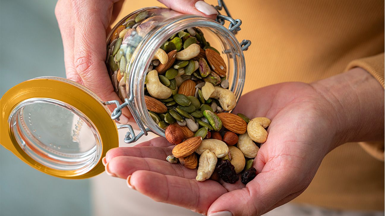 Nuts being poured out of mason jar