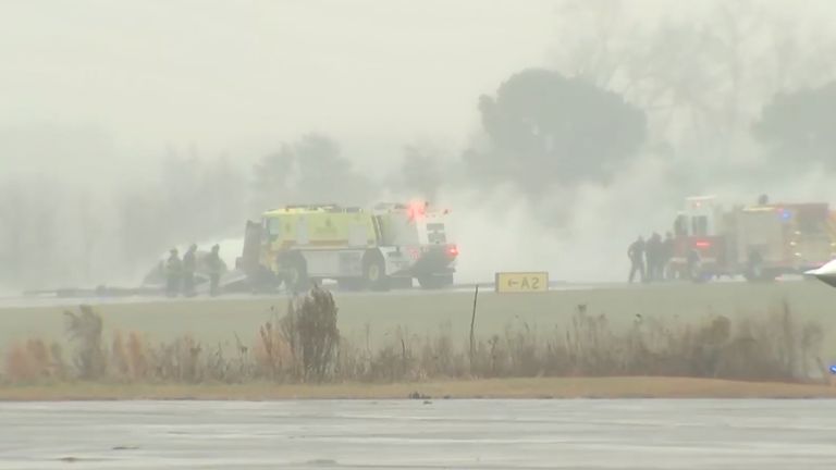 Firefighting crews respond to the crash. Pic: AP 