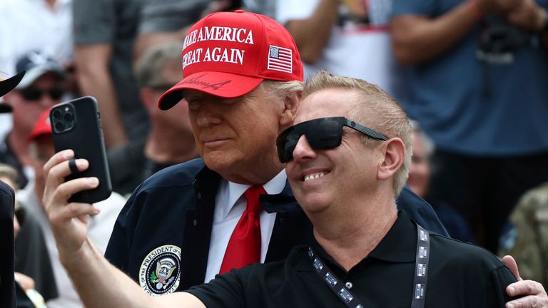 Donald Trump stops for a selfie with Biffle at the Daytona International Speedway in February. Pic: AP 