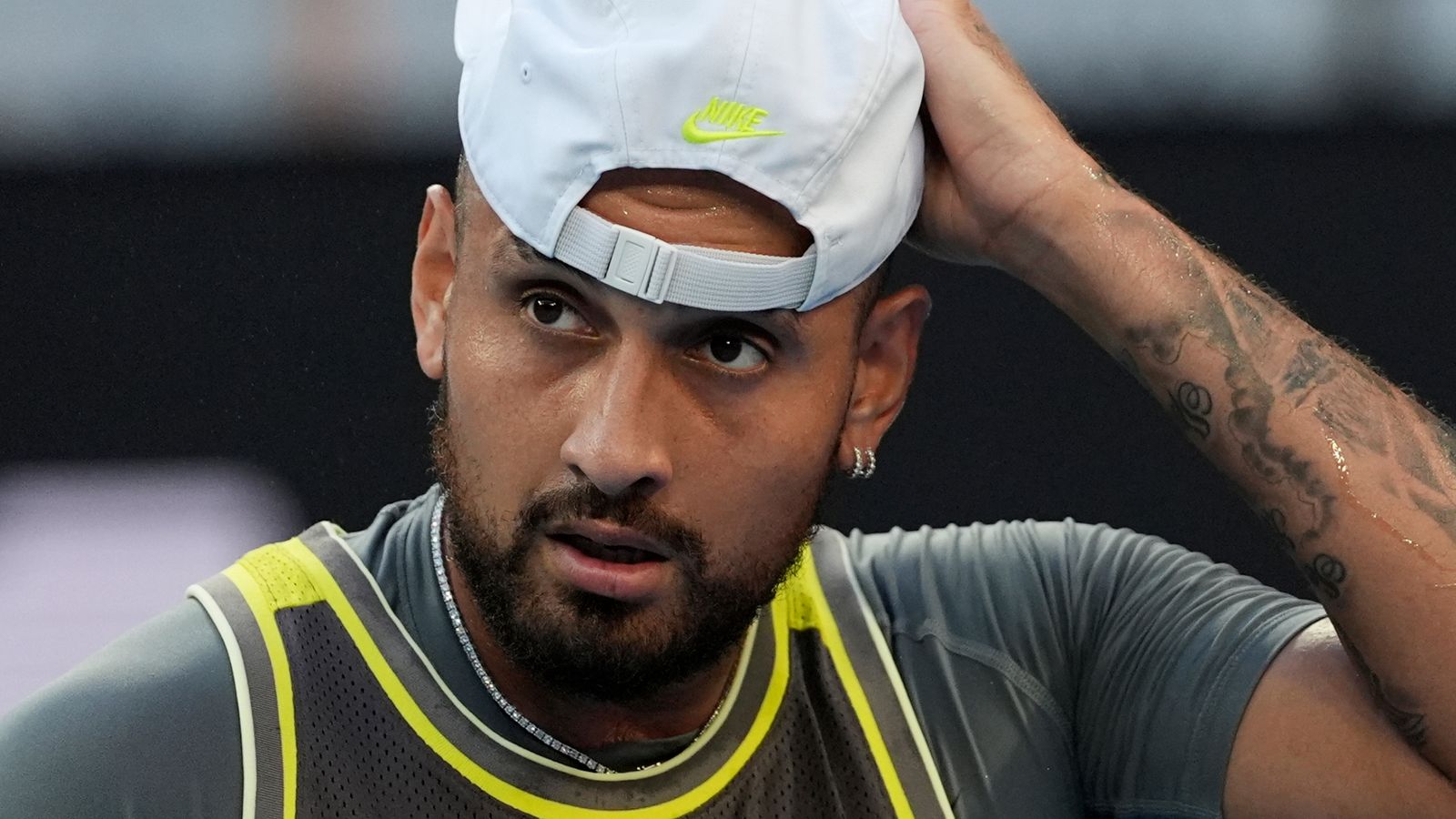 Nick Kyrgios of Australia prepares to serve to Jacob Fearnley of Britain during their first round match at the Australian Open tennis championship in Melbourne, Australia, Monday, Jan. 13, 2025. (AP Photo/Ng Han Guan)
