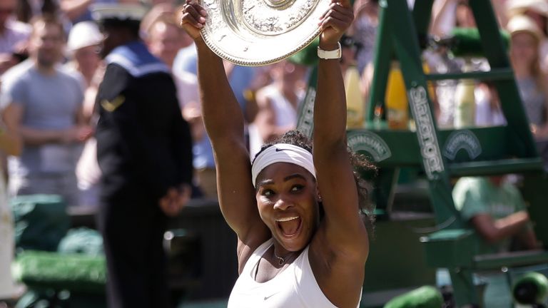 Serena Williams holds up the trophy after winning the Wimbledon  women's singles final in 2015