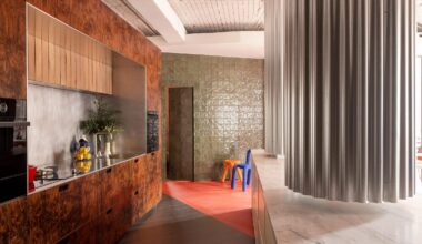 Tabula Studio combines red floors and trompe l'oeil details in Bilbao office