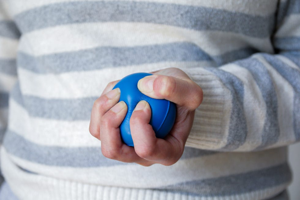 easy fitness resolutions: hand gripping a stress ball