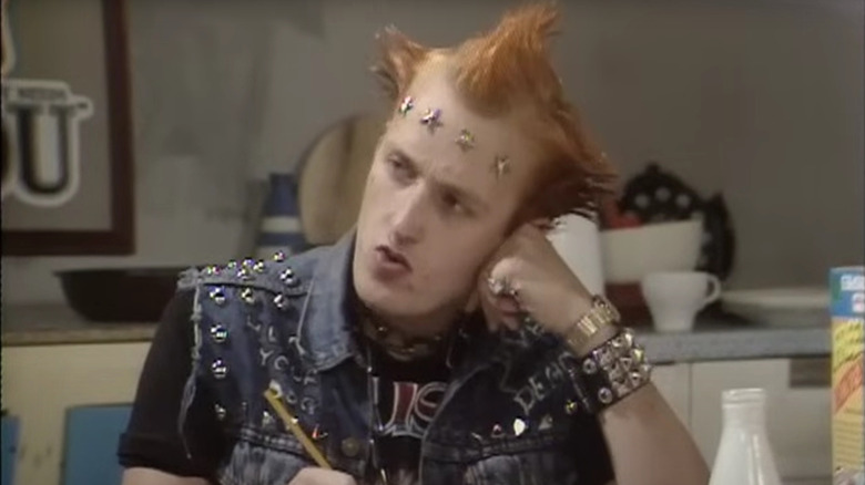 Adrian Edmondson as Vyvyan, attempting to enter a cereal box contest in The Young Ones