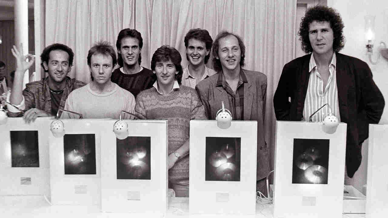 Dire Straits picking up a sales award in 1985
