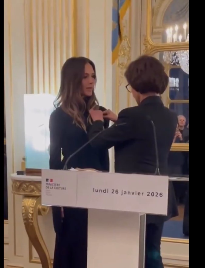 Victoria Beckham being presented with the Chevalier of the Order of Arts and Letters by culture minister Rachida Dati.