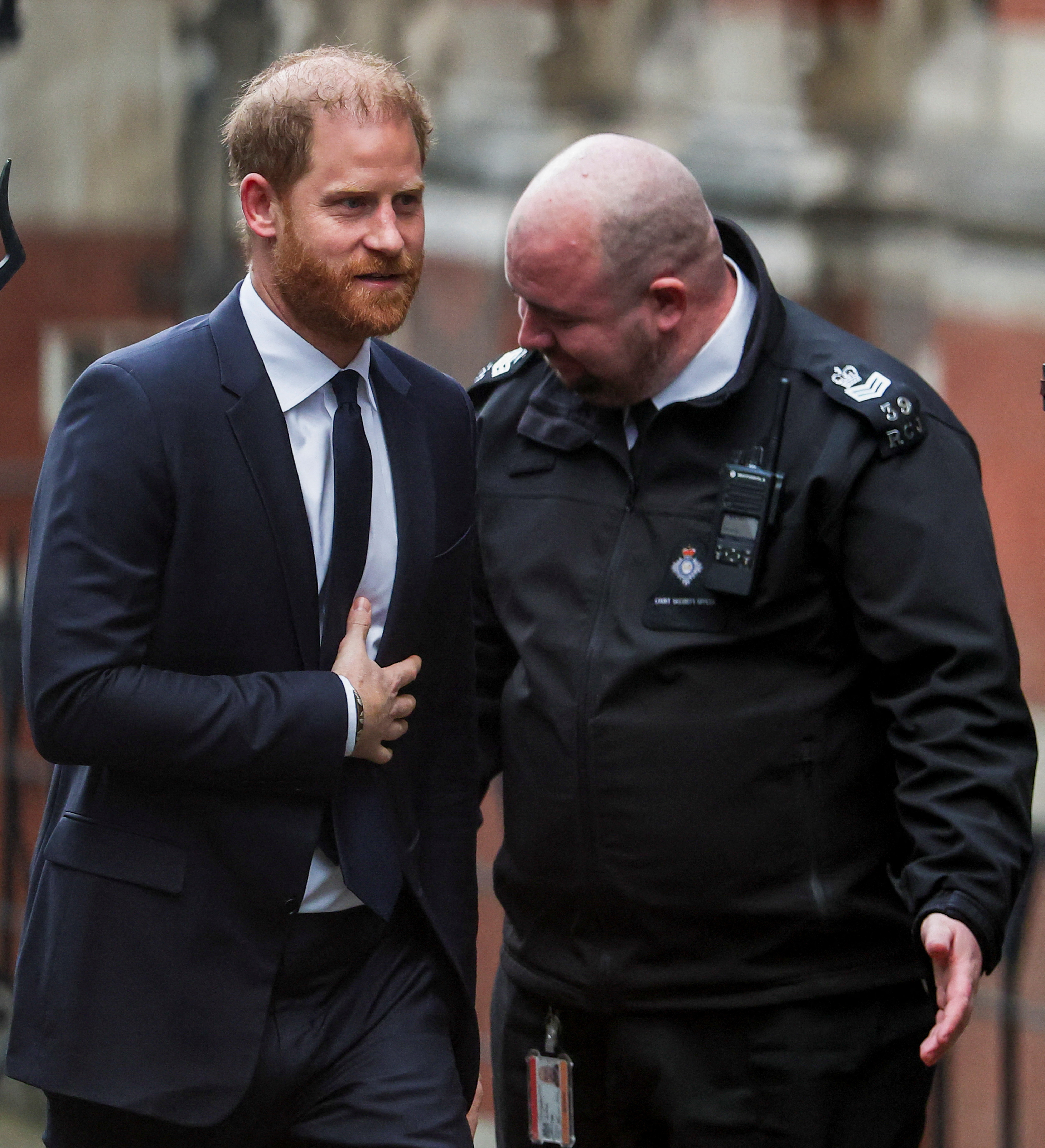 Prince Harry arriving at the High Court in London for a phone-hacking lawsuit against Associated Newspapers.