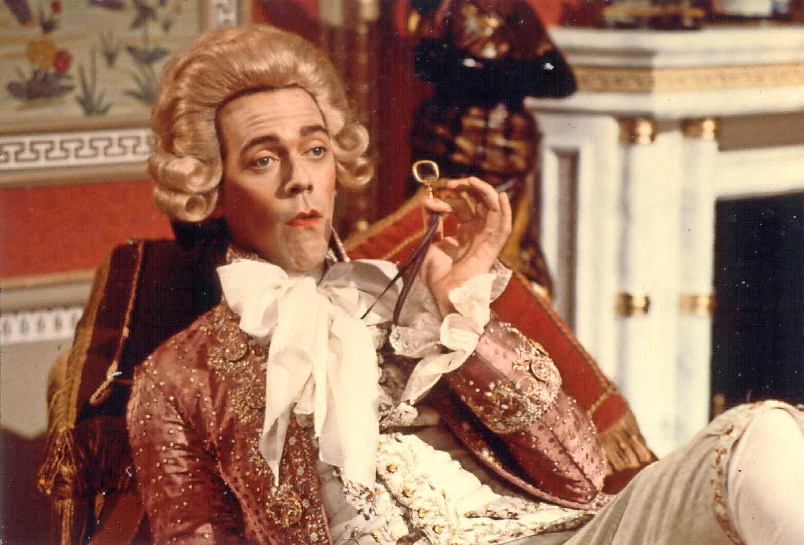 Hugh Laurie in character as a comedian.