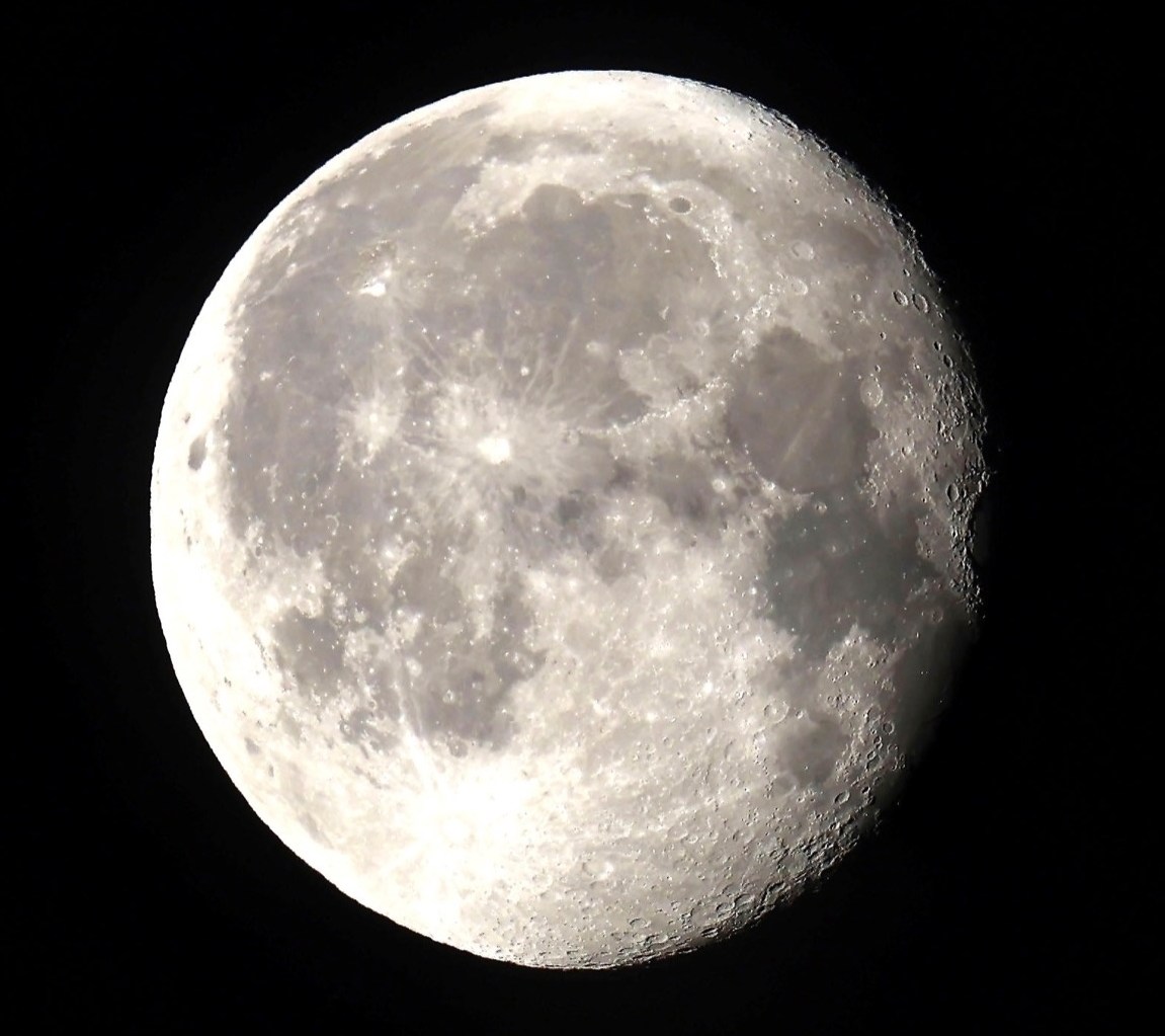 Waning gibbous moon against a black sky.