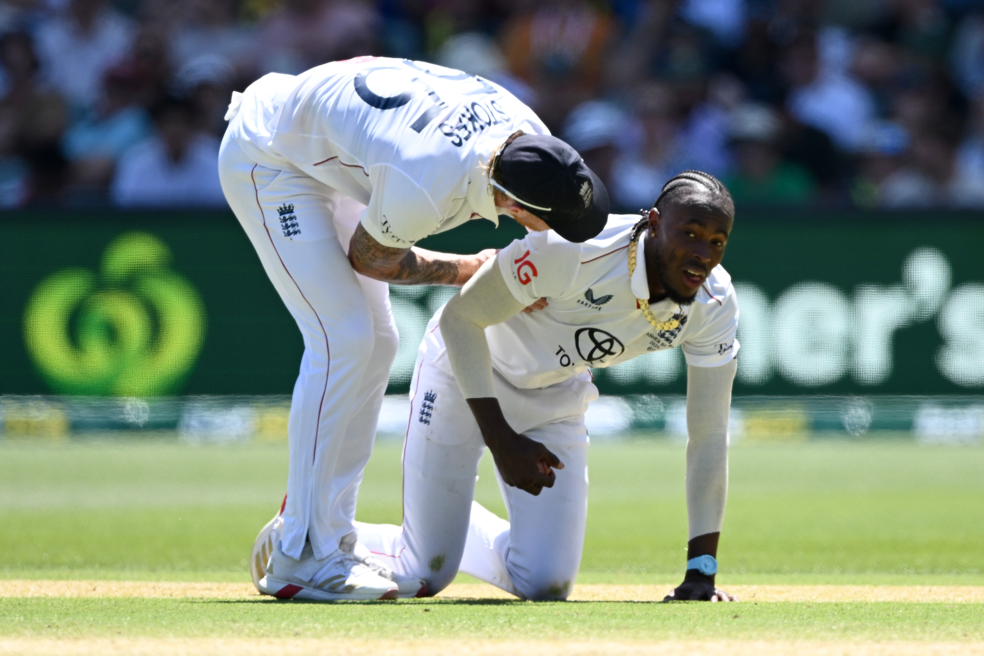 England's Jofra Archer is congratulated by captain Ben Stokes after catching Scott Boland from his own bowling.