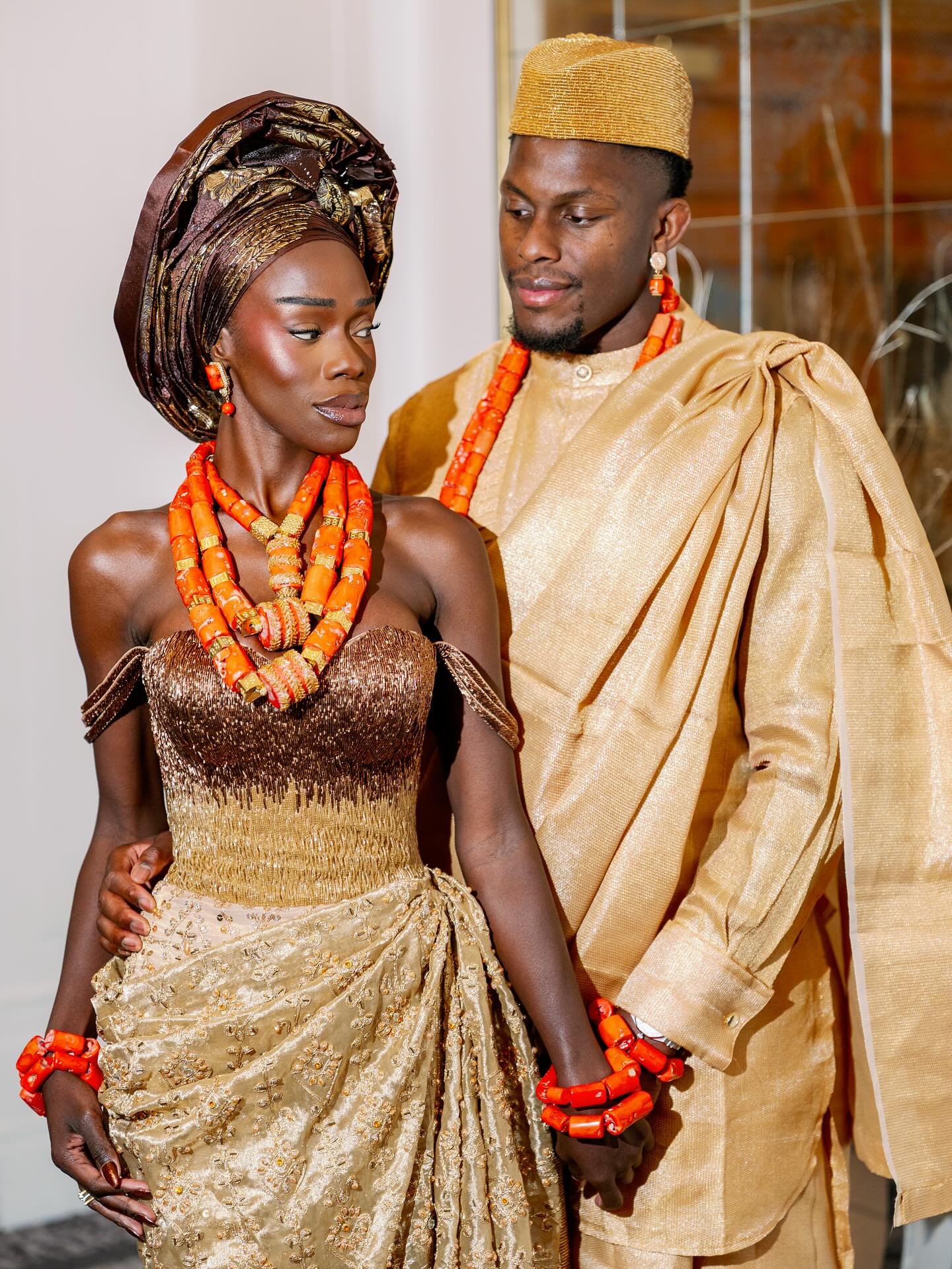 Maro and Mimi Itoje dressed in traditional Nigerian wedding attire.