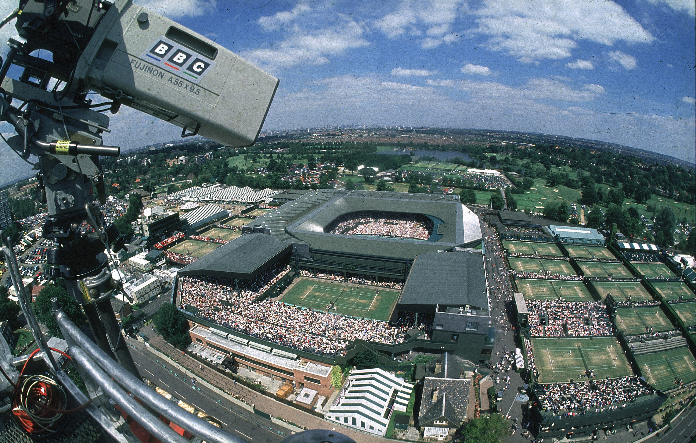 An aerial view of the Wimbledon tennis tournament from a BBC camera on a cherry picker.