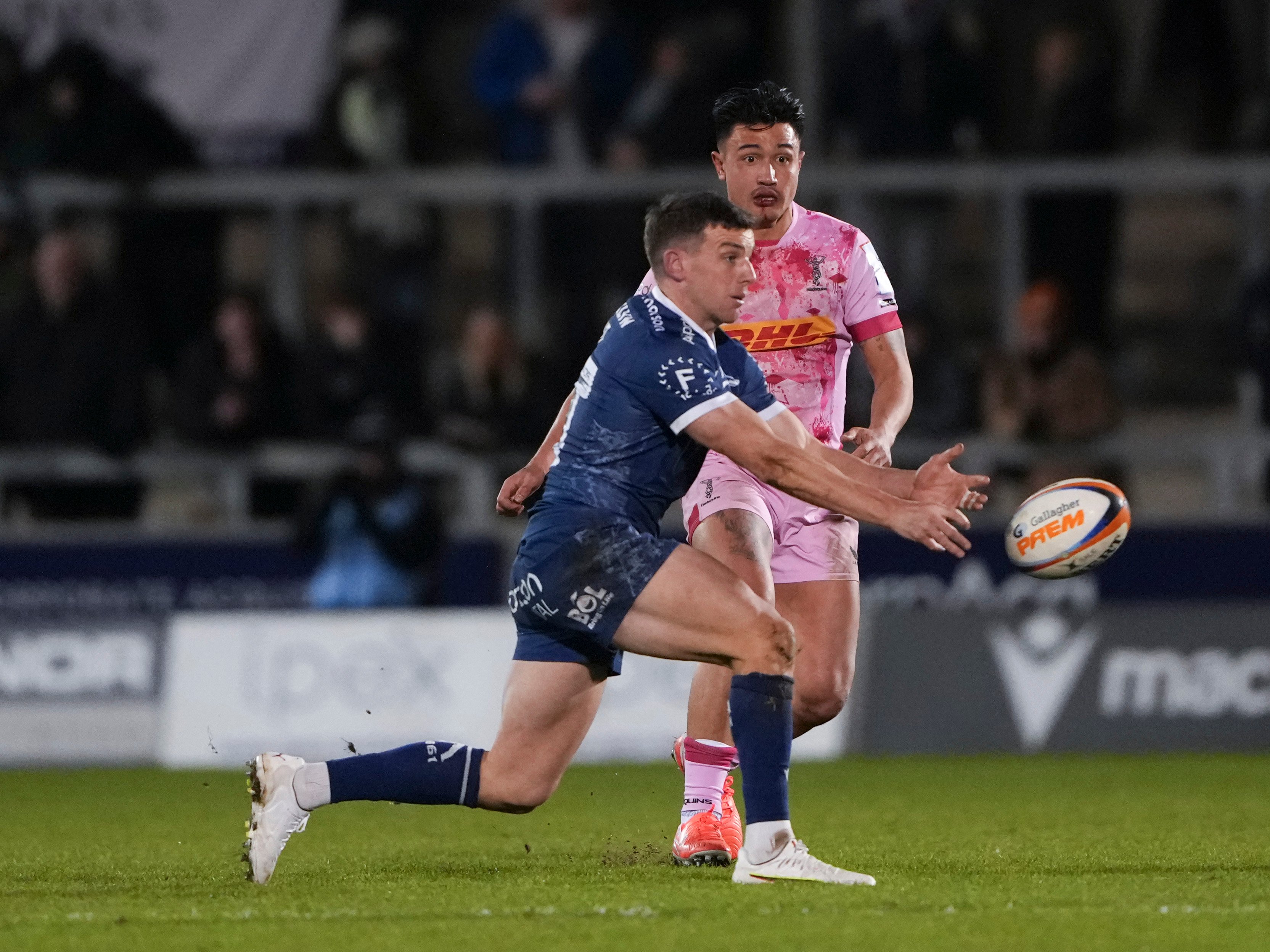 Marcus Smith of Harlequins keeping his eye on George Ford, a rugby player for Sale.