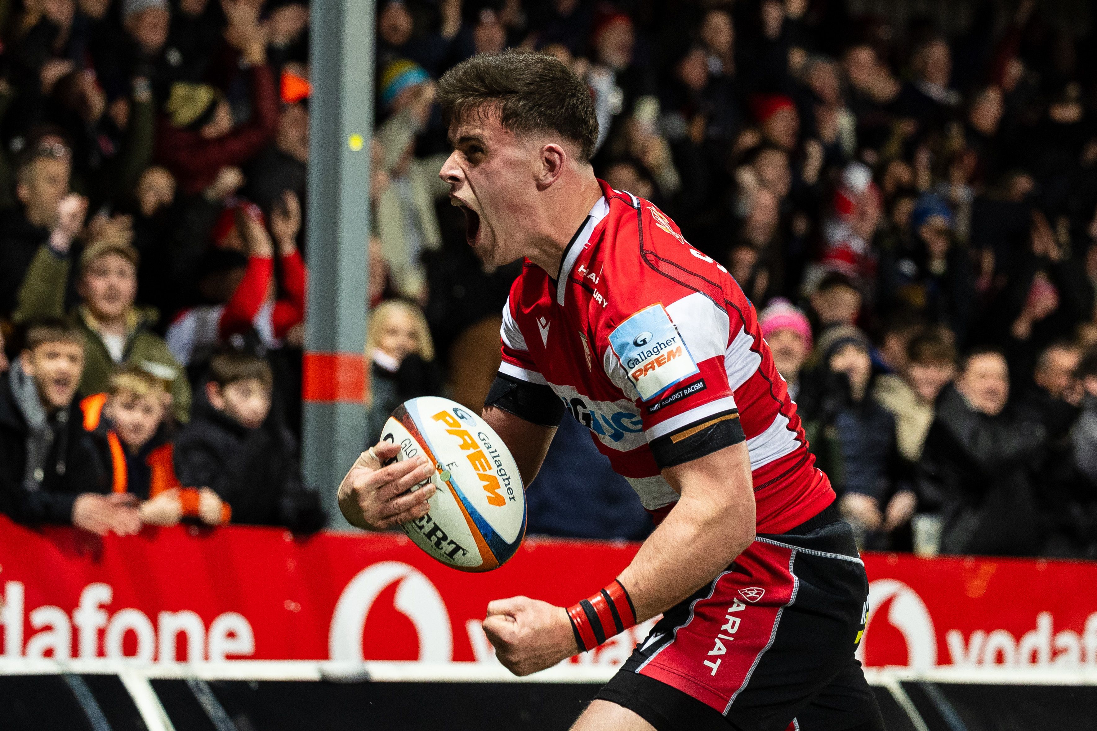 Seb Atkinson of Gloucester Rugby celebrates scoring a try.